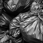 Garbage black bag background. Pile of black bin bag for gabage, Trash black bag.